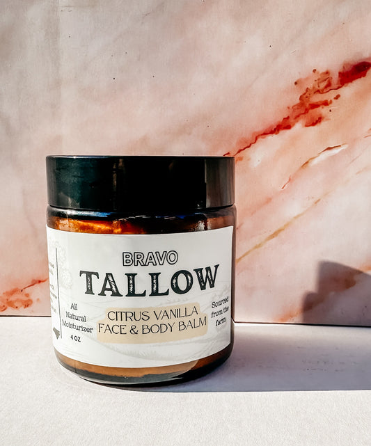 Jar of Bravo Tallow Citrus Vanilla Face & Body Balm on a marble background